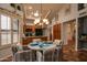 Cozy dining area near the kitchen with a decorative chandelier and shuttered windows at 13731 W Greenview Dr, Sun City West, AZ 85375