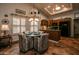 The dining area has tiled floors, shuttered windows, and a lovely chandelier at 13731 W Greenview Dr, Sun City West, AZ 85375