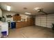 Spacious garage with ample storage cabinets, laundry, and work space at 13731 W Greenview Dr, Sun City West, AZ 85375