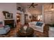 Inviting living room flows into dining area and kitchen, featuring tile flooring and high ceilings at 13731 W Greenview Dr, Sun City West, AZ 85375