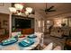 Inviting living room and dining area with ample natural light and comfortable seating for a casual setting at 13731 W Greenview Dr, Sun City West, AZ 85375