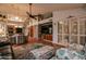 Bright and airy living space with shuttered windows, an entertainment center and easy kitchen access at 13731 W Greenview Dr, Sun City West, AZ 85375
