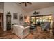 Cozy living room with tile flooring, high ceilings, and sliding glass doors to the patio at 13731 W Greenview Dr, Sun City West, AZ 85375