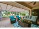 Relaxing covered patio featuring stylish outdoor seating, perfect for entertaining at 13731 W Greenview Dr, Sun City West, AZ 85375