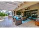 Charming covered patio with seating area, ideal for enjoying outdoor living at 13731 W Greenview Dr, Sun City West, AZ 85375