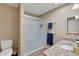 Well-lit bathroom with tiled walk-in shower and granite countertop vanity at 13806 N Del Webb Blvd, Sun City, AZ 85351