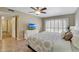 Bedroom with TV and lots of natural light with neutral walls and matching furniture at 13806 N Del Webb Blvd, Sun City, AZ 85351
