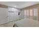 Bedroom with built-in storage and a large closet; shuttered windows let in ample light at 13806 N Del Webb Blvd, Sun City, AZ 85351
