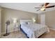 Cozy bedroom featuring a ceiling fan, comfortable bed, and neutral color scheme at 13806 N Del Webb Blvd, Sun City, AZ 85351