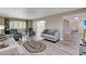 Spacious living room featuring neutral tones, comfortable seating, and bright, natural light at 13806 N Del Webb Blvd, Sun City, AZ 85351