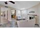 Living room with fireplace, tile floors, and bright natural light at 13806 N Del Webb Blvd, Sun City, AZ 85351