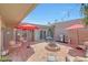Backyard featuring a patio, a fire pit, seating, grill, and updated fixtures at 13806 N Del Webb Blvd, Sun City, AZ 85351