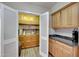 A kitchen pantry with built in shelves at 13806 N Del Webb Blvd, Sun City, AZ 85351