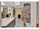 Bathroom featuring double sinks, decorative tile backsplash, and updated fixtures at 13806 N Del Webb Blvd, Sun City, AZ 85351