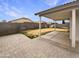 Large, private backyard with a covered patio and block fence, perfect for outdoor living at 1399 E Santa Fiore St, San Tan Valley, AZ 85140