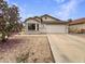 Charming single-story home with a well-maintained front yard and a two-car garage at 1399 E Santa Fiore St, San Tan Valley, AZ 85140