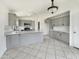 Spacious kitchen featuring ample counter space and gray cabinets at 1399 E Santa Fiore St, San Tan Valley, AZ 85140