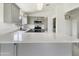 Bright kitchen featuring gray cabinetry, stainless steel appliances, and white countertops at 1399 E Santa Fiore St, San Tan Valley, AZ 85140