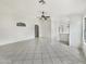 Expansive living room with tile flooring and abundant natural light at 1399 E Santa Fiore St, San Tan Valley, AZ 85140