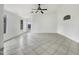 Open concept living room featuring tile flooring and a ceiling fan at 1399 E Santa Fiore St, San Tan Valley, AZ 85140