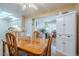 Dining area with wooden table, and access to office and kitchen spaces at 14080 N Newcastle Dr, Sun City, AZ 85351