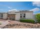 Charming single-story home featuring desert landscaping, and modern solar panels on the roof at 14080 N Newcastle Dr, Sun City, AZ 85351