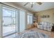 Bright sitting room featuring sliding glass door, wood floors, and comfortable seating at 14080 N Newcastle Dr, Sun City, AZ 85351