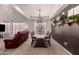 Bright dining room with an elegant chandelier, modern decor, and seating for six at 1446 E Douglas St, Casa Grande, AZ 85122
