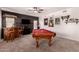 Spacious game room with a wooden bar and billiard table, perfect for entertaining guests at 1446 E Douglas St, Casa Grande, AZ 85122