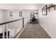 Bright hallway featuring a desk area, neutral carpet, and multiple windows for ample natural light at 1446 E Douglas St, Casa Grande, AZ 85122