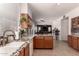 Well-lit kitchen boasts granite countertops, a tile backsplash, and stainless steel appliances at 1446 E Douglas St, Casa Grande, AZ 85122