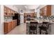 Well-lit kitchen boasts granite countertops, a tile backsplash, and stainless steel appliances at 1446 E Douglas St, Casa Grande, AZ 85122