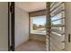Open-air balcony featuring shuttered windows overlooking a scenic neighborhood street at 14878 W Windrose Dr, Surprise, AZ 85379