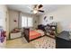 Cozy bedroom with a colorful rug, playful wall art, and a comfortable single bed at 14878 W Windrose Dr, Surprise, AZ 85379