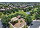 Community park featuring playground, basketball court, ramada, and mature trees, providing a recreational space for residents at 14878 W Windrose Dr, Surprise, AZ 85379