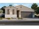 Charming single story home featuring low maintenance landscaping and a neutral color scheme at 16010 W Desert Hollow Dr, Surprise, AZ 85387