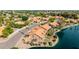 Picturesque lakefront home featuring a private yard, mature trees, and stunning water views at 1625 W Gunstock Loop, Chandler, AZ 85286