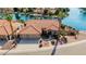 Aerial view of a home with a red tile roof, three-car garage, and waterfront access on a scenic canal at 1625 W Gunstock Loop, Chandler, AZ 85286