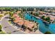Lovely home on a tranquil lake, surrounded by lush landscaping and mature palm trees at 1625 W Gunstock Loop, Chandler, AZ 85286