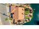 Aerial view showcasing the home's tile roof, well-maintained landscaping, and proximity to the lake at 1625 W Gunstock Loop, Chandler, AZ 85286