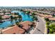 Beautiful lakefront home with mature trees and well-maintained landscaping at 1625 W Gunstock Loop, Chandler, AZ 85286