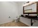 Bathroom with granite countertops, under mount sink, and decorative mirror at 1625 W Gunstock Loop, Chandler, AZ 85286