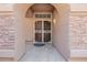 A welcoming arched entryway and decorative screen door lead into this charming home at 1625 W Gunstock Loop, Chandler, AZ 85286