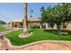 Charming home exterior with palms and lush landscaping creating curb appeal at 1625 W Gunstock Loop, Chandler, AZ 85286