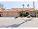 Charming single-story home featuring a tile roof, stone accents, desert landscaping, and a spacious three-car garage at 1625 W Gunstock Loop, Chandler, AZ 85286