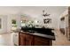 Open concept kitchen features a two-tiered island with seating and a seamless transition to the living area at 1625 W Gunstock Loop, Chandler, AZ 85286