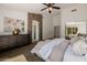This cozy main bedroom features a stone archway and neutral color palette at 1625 W Gunstock Loop, Chandler, AZ 85286