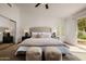 Spacious bedroom boasts a luxurious bed, ample natural light, and stylish decor elements at 1625 W Gunstock Loop, Chandler, AZ 85286