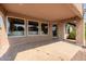 Inviting covered patio with tiled floor, offering an ideal space for relaxation and outdoor entertainment at 1625 W Gunstock Loop, Chandler, AZ 85286