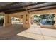 Covered patio area with a pergola, bench seating, and a view of a fountain, perfect for relaxing at 1625 W Gunstock Loop, Chandler, AZ 85286